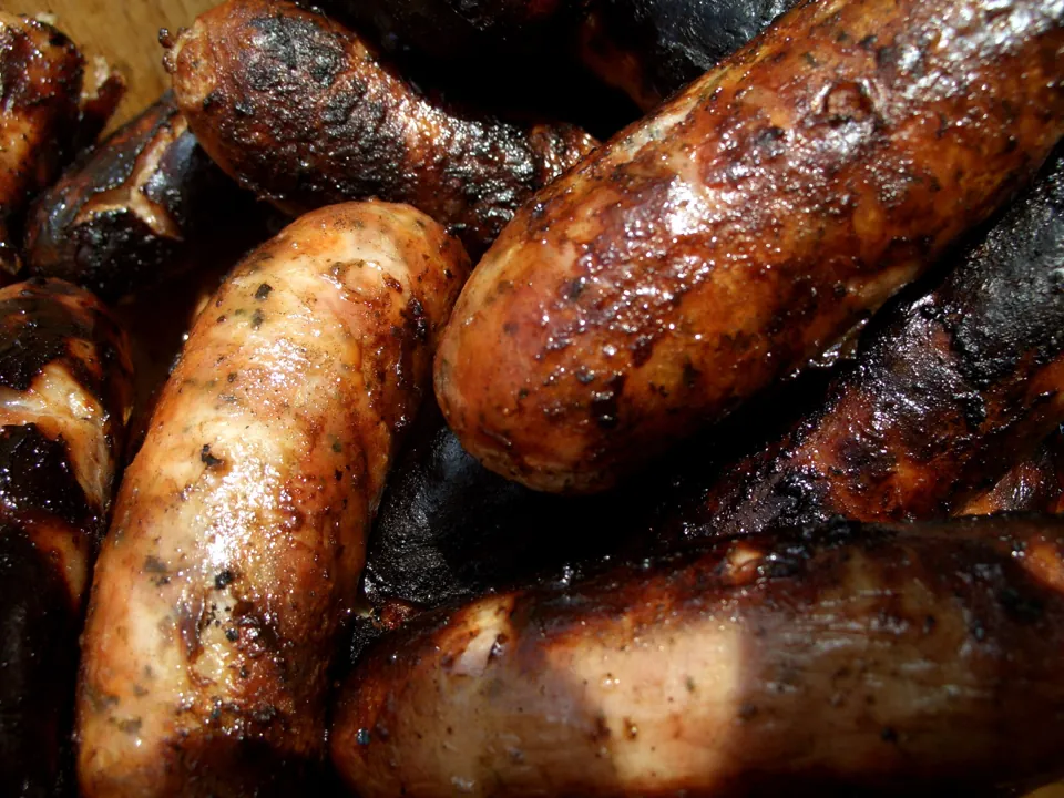 Sausages in a wooden bowl