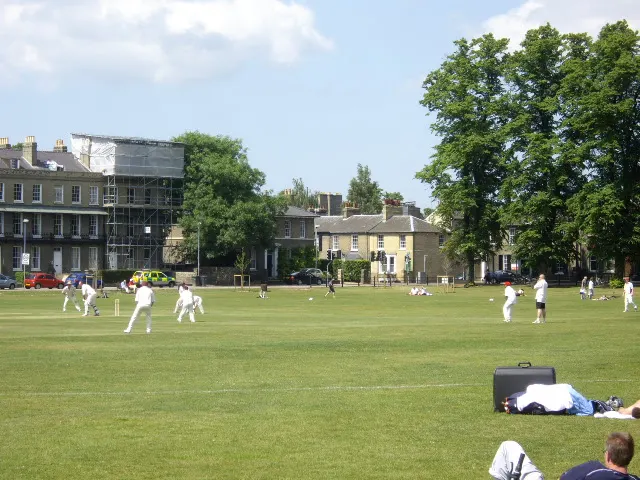 Cambridge market or setting: A cricket match on Parker's Piece On a fine warm day at the end of May.