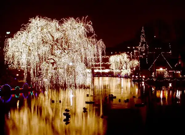 Tivoli Gardens lights reflected in the lake in an archive photograph uploaded in 2006. Garden setting, not a record of the 2026 Christmas market