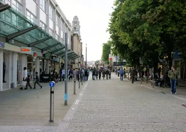 Oxford Street in Swansea city centre in August 2009, with shops and pedestrians; no Christmas chalets pictured