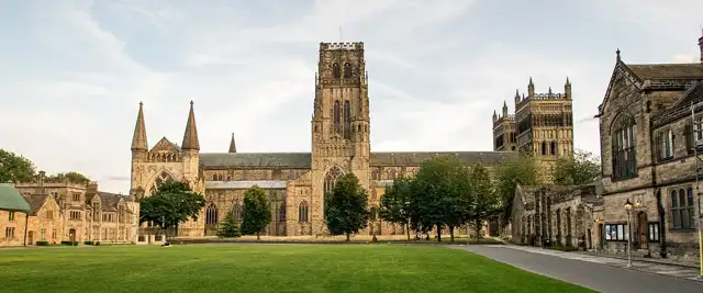 w:Durham Cathedral from w:Palace Green, with Palace Green Library to the right and Bishop Cosin's Almshouses and the Pemberton Rooms on the left.
