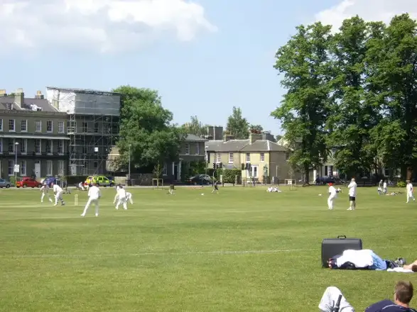 Cambridge market or setting: A cricket match on Parker's Piece On a fine warm day at the end of May
