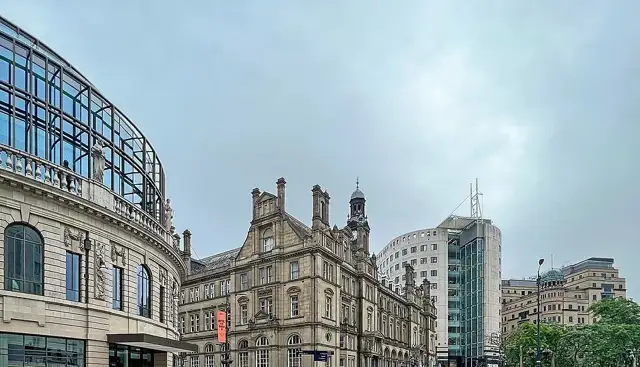 Nearby: Historic and modern buildings beside City Square in Leeds